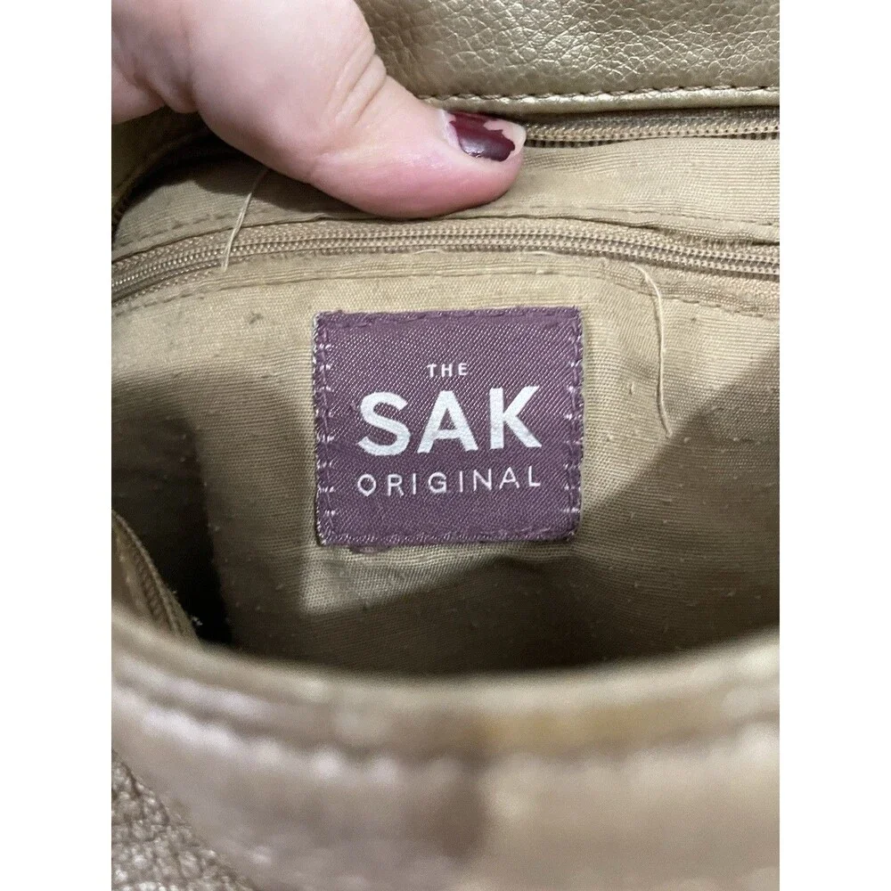 The SAK Gold Pebbled Leather Hobo Shoulder Bag Purse Single Strap Handbag